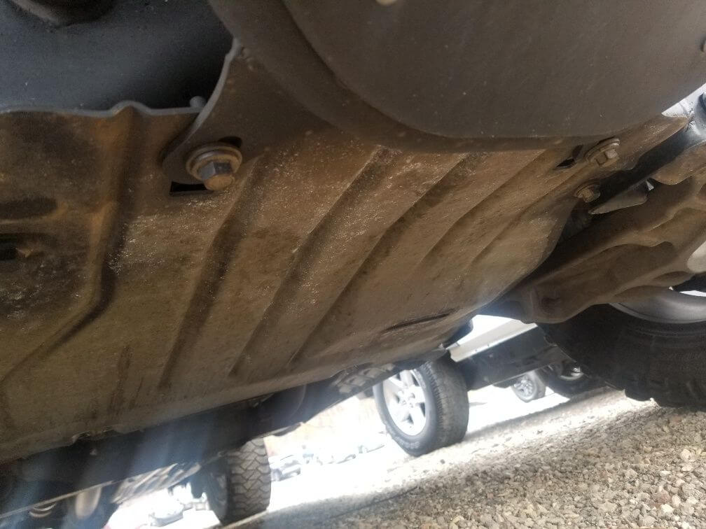 Skid plate below engine oil pan drain plug on Gen 1 Ford Raptor