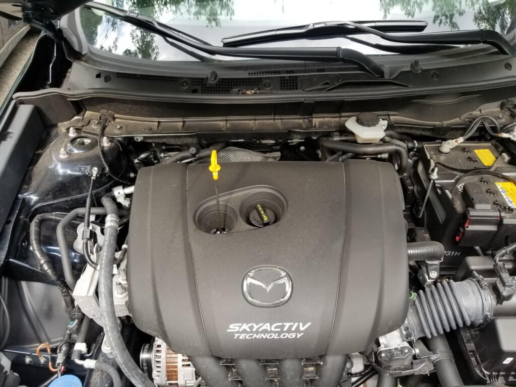 Mazda CX3 engine bay with oil fill cap and dip stick pictured