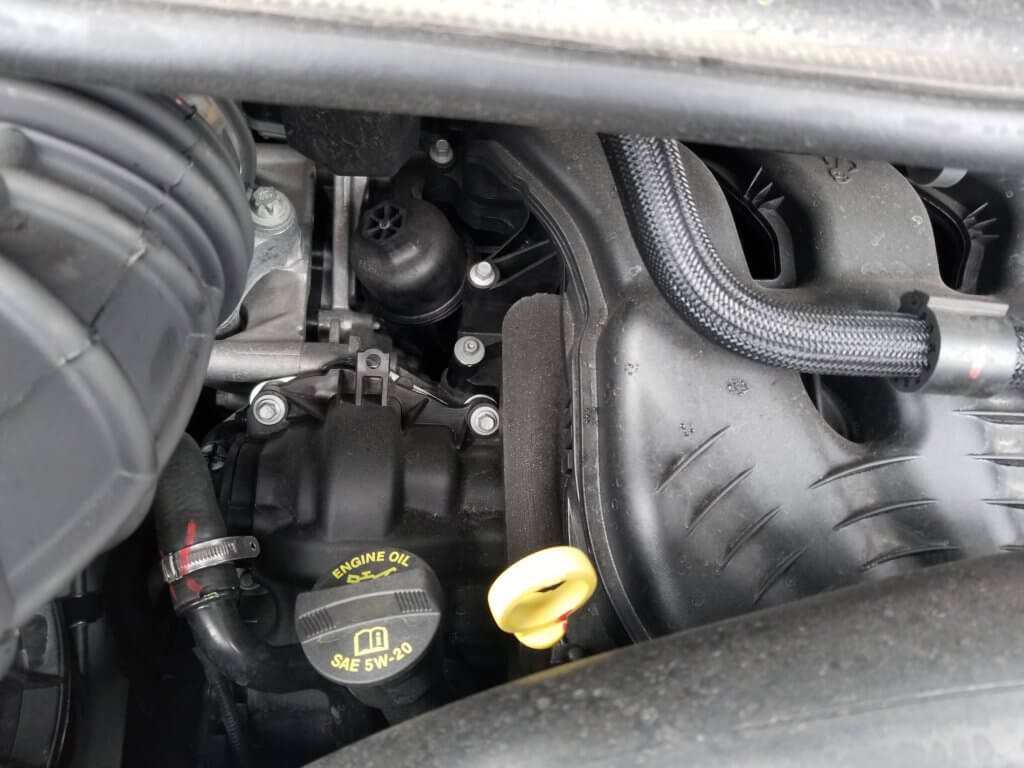 Ram Promaster engine oil fill cap, dipstick and filter cap pictured
