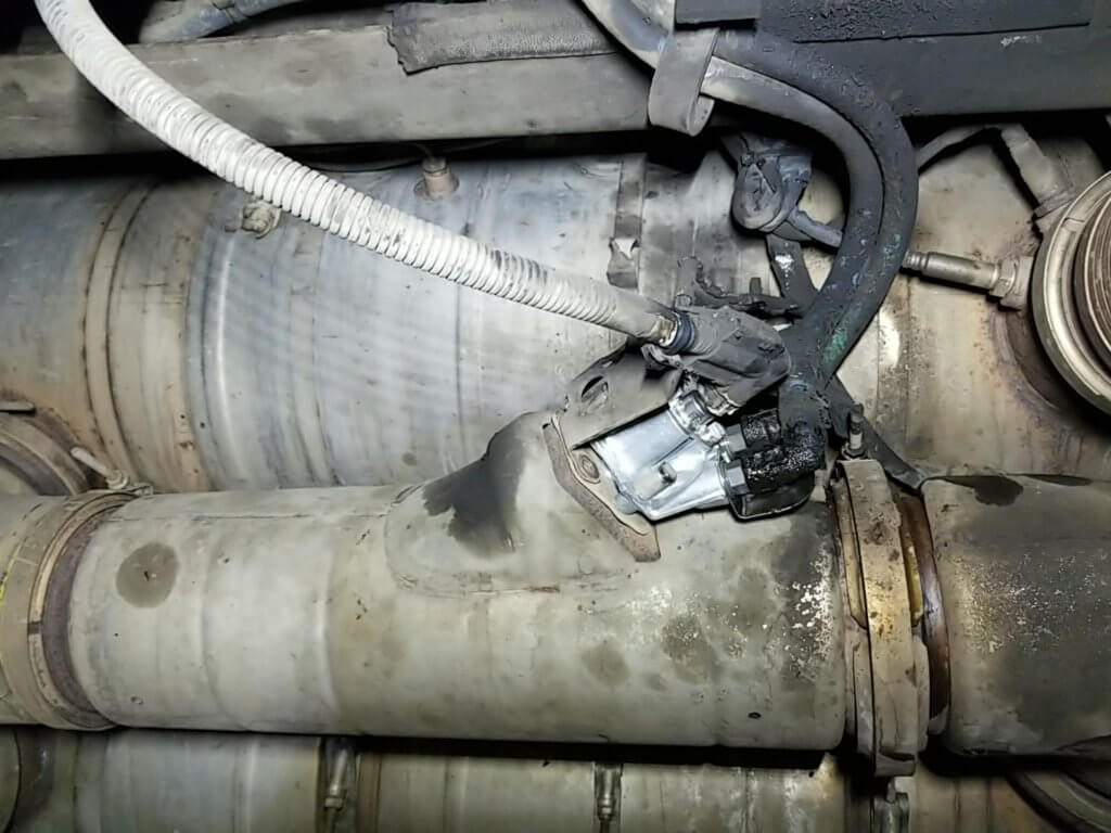 Cummins ISX DEF doser mounted to pipe