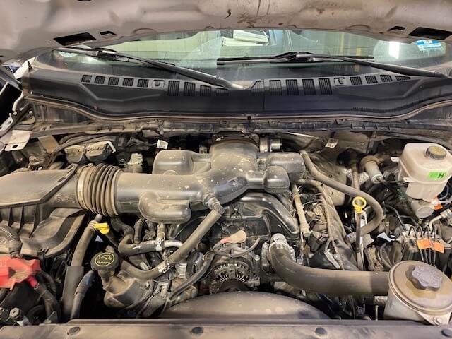 Ford 6.8L Triton engine bay with engine oil fill cap and dip stick
